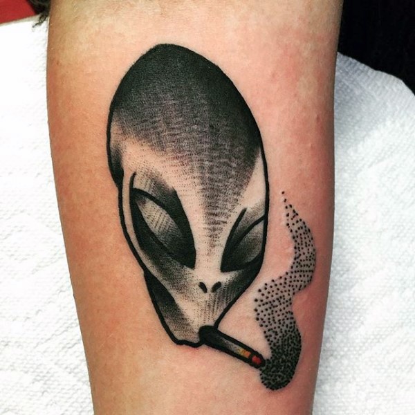 Funny painted little colored smoking alien tattoo on arm