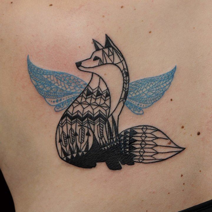Geometric black ink fox with blue wings tattoo