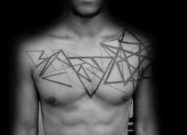 Geometric style black and white chest tattoo of various figures