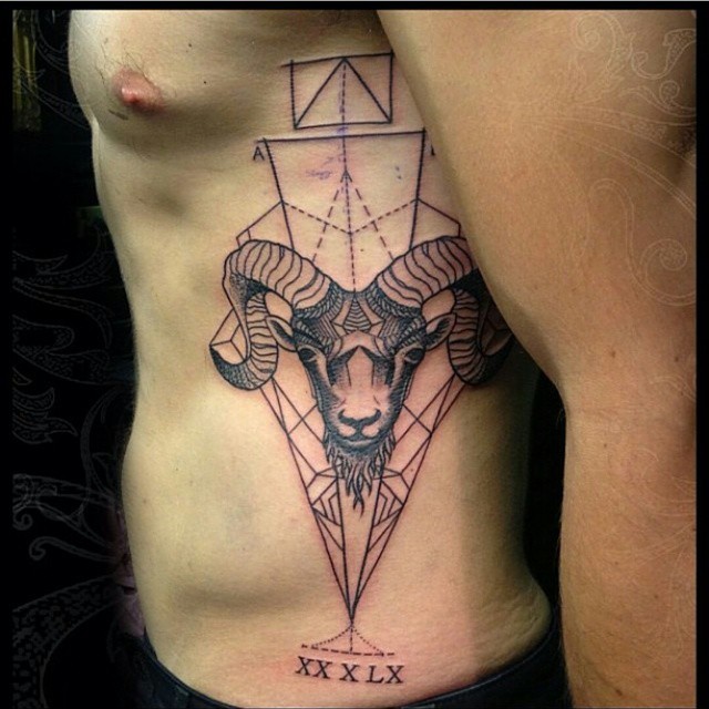 Geometrical style black and white Capricorn head tattoo with various figures and date