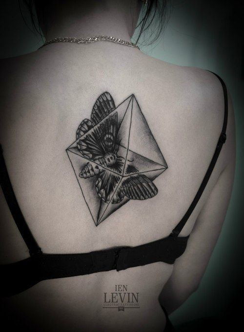 Geometrical style black ink back tattoo of rhomb with butterfly