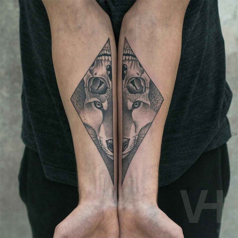 Geometrical style black ink split tattoo by Valentin Hirsch of fox and human skull