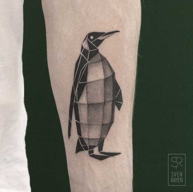 Geometrical style colored arm forearm tattoo of cute penguin
