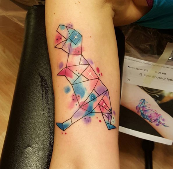 Geometrical style colored arm tattoo of dinosaur