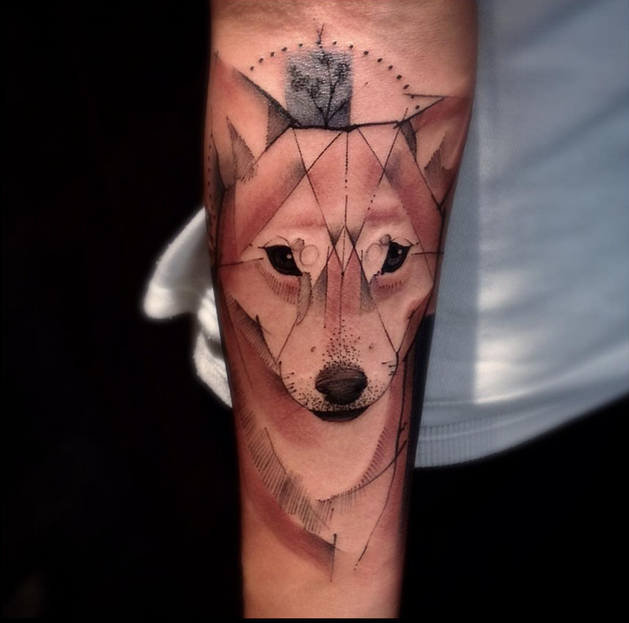 Geometrical style colored forearm tattoo of fox head