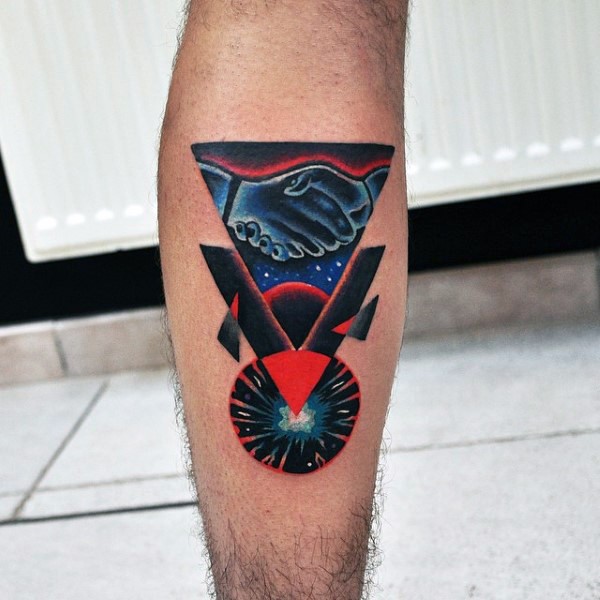 Geometrical style colored leg tattoo of various figures and handshake