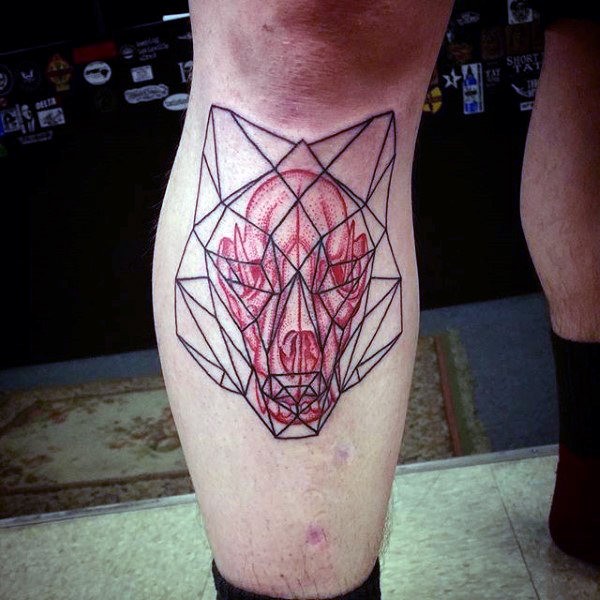 Geometrical style colored leg tattoo of animal skull with figures