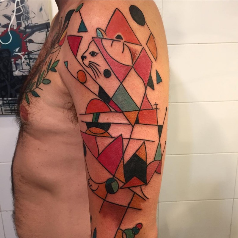 Geometrical style colored shoulder tattoo of interesting looking cat
