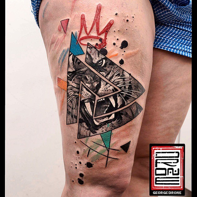 Geometrical style colored thigh tattoo of triangles with roaring tiger