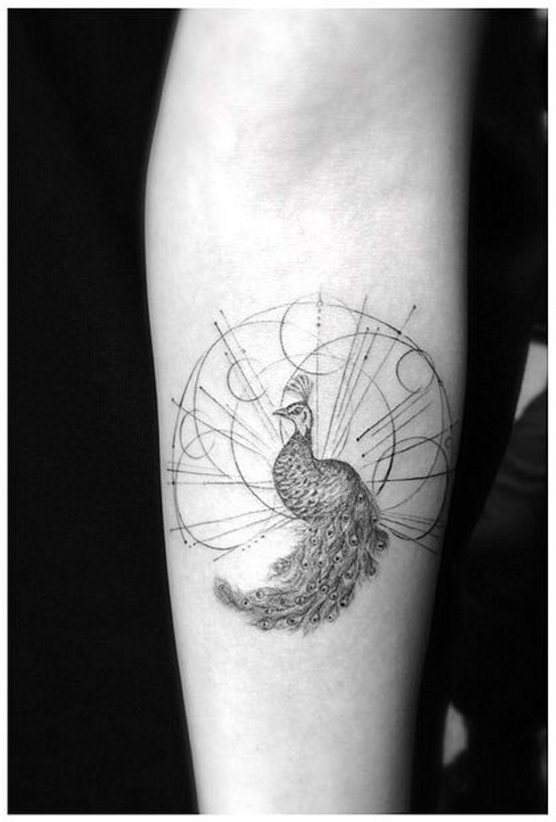 Geometrical style little peacock tattoo on arm