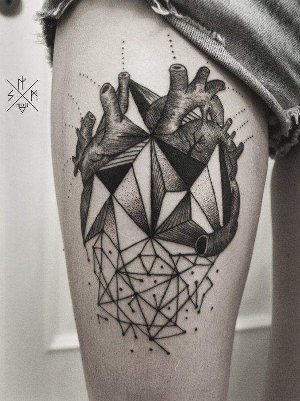 Geometrical style painted black and white heart tattoo on thigh