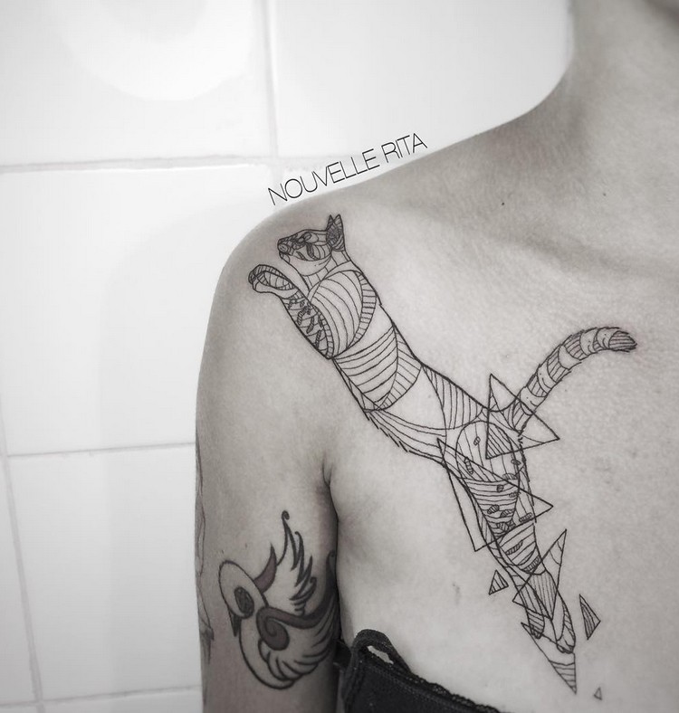 Geometrical style shoulder tattoo of cat with triangles and lines