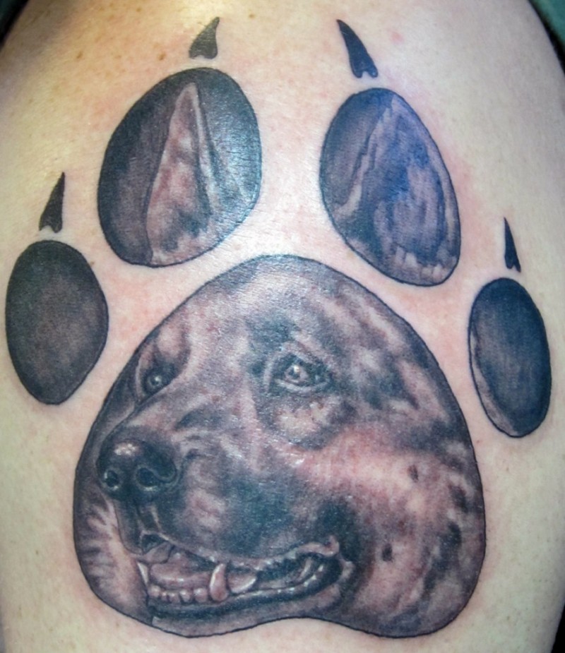 German shepherd tattoo in dogs paw