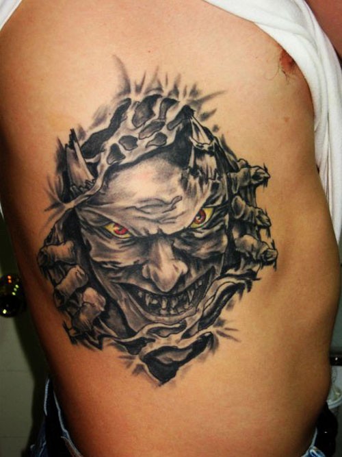 Ghoulish demon under skin rip tattoo