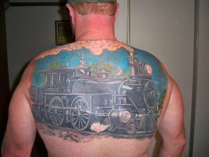 Giant colored detailed steaming naturally looking train tattoo on upper back