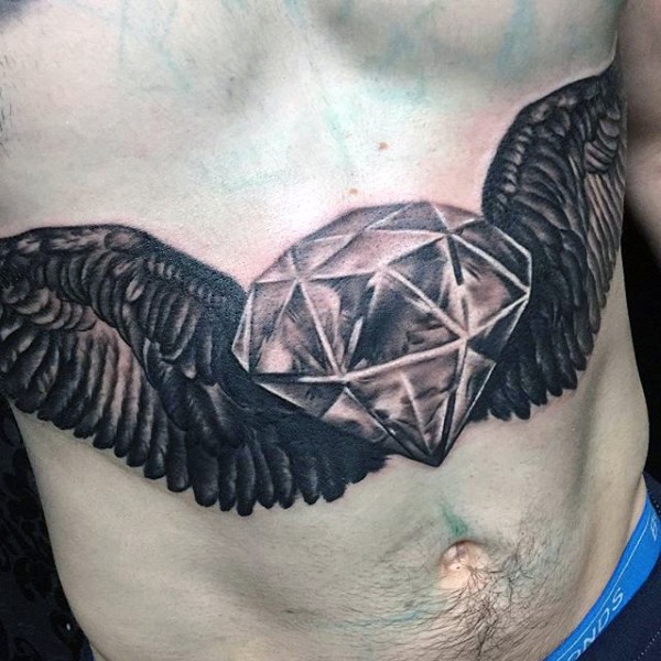 Giant diamond with huge pair of feather wings tattoo on belly
