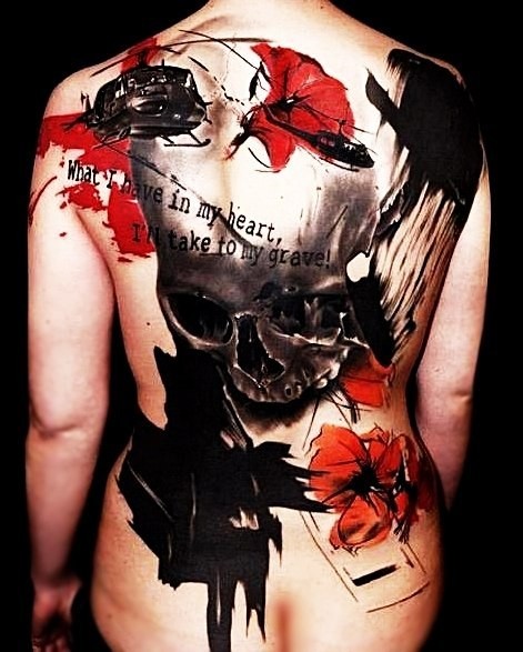 Giant skull colored horror style tattoo on whole back stylized with helicopter, poppy and lettering
