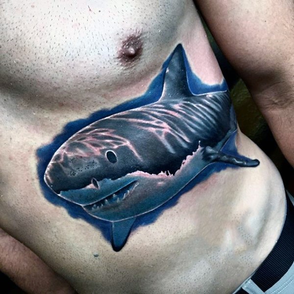 Giant swimming shark in water naturally colored tattoo on belly in realism style