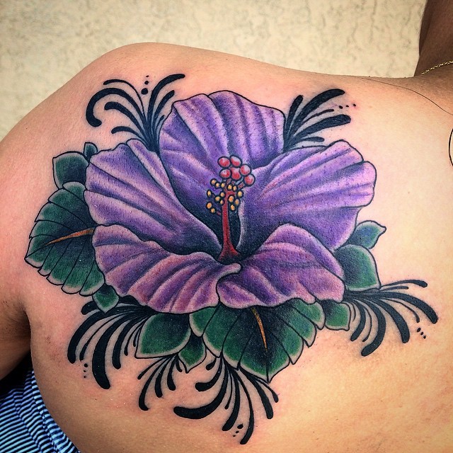 Giant violet hibiscus flower with black elements colored shoulder blade tattoo Hawaiian themed