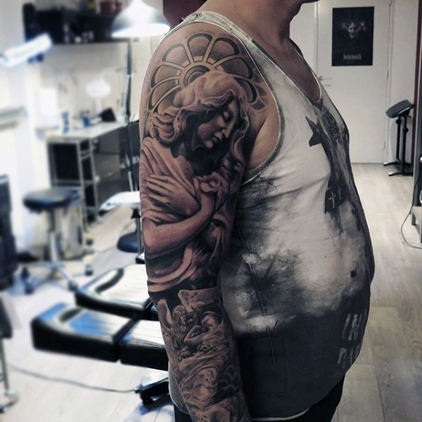 Glorious black ink religious themed tattoo on sleeve