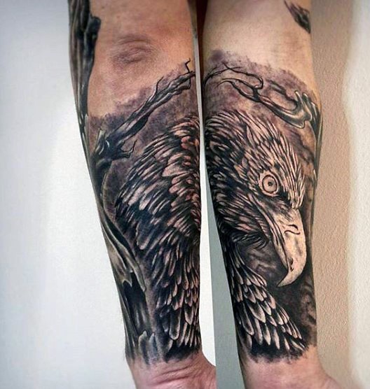 Gorgeous black and white eagle head tattoo on arm