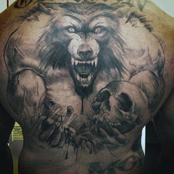 Gorgeous black and white whole back tattoo of demonic werewolf with human bones