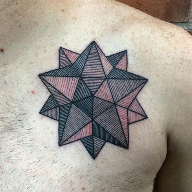 Gorgeous colored star shaped geometrical tattoo on chest
