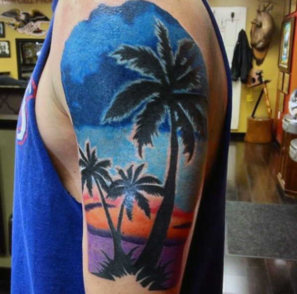 Gorgeous colorful sunset with palm trees tattoo on half sleeve zone