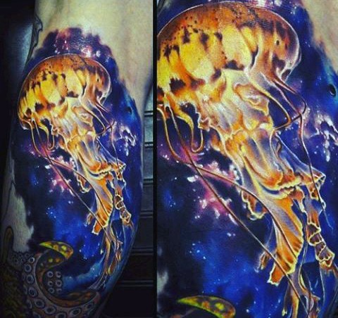 Gorgeous detailed and colored massive jellyfish tattoo on arm