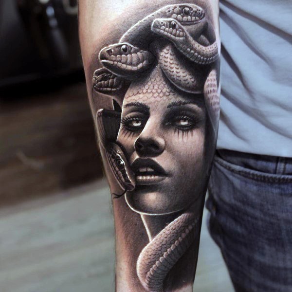 Gorgeous detailed black and white seductive Medusa tattoo on arm