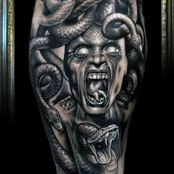 Gorgeous detailed horrifying Medusa head tattoo on thigh