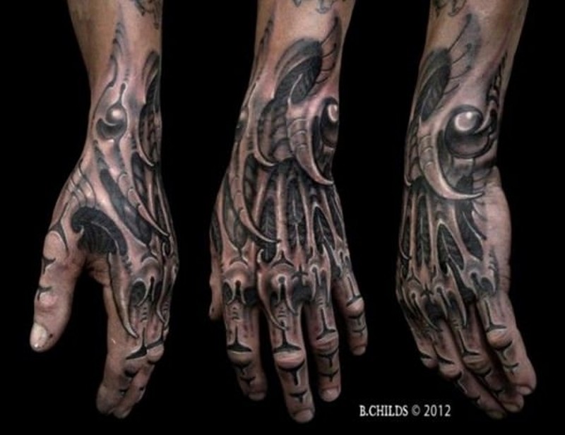 Gorgeous looking black ink detailed wrist and hand tattoo of alien like skeleton