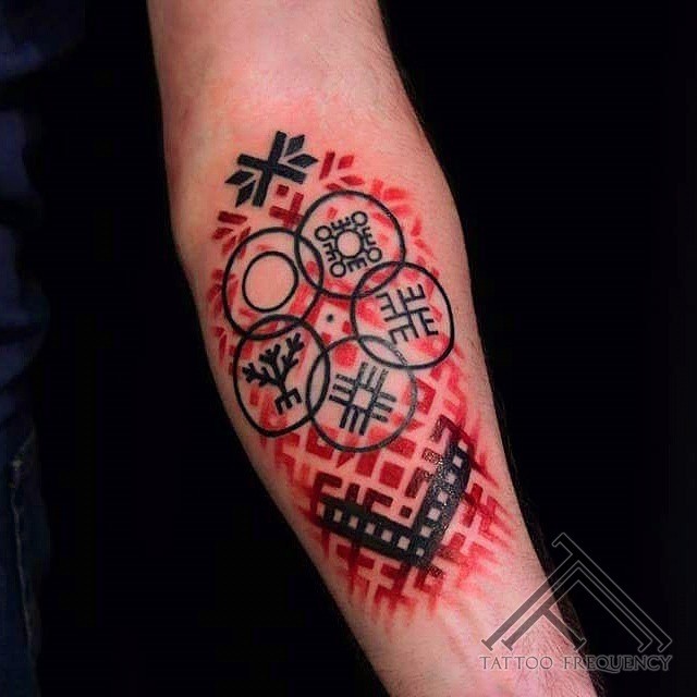 Gorgeous looking colored arm tattoo of mystical symbols