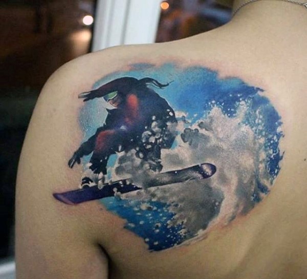 Gorgeous looking colored scapular tattoo of snowboarder