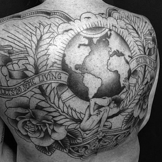 Gorgeous looking detailed whole back tattoo of awesome planet with lettering