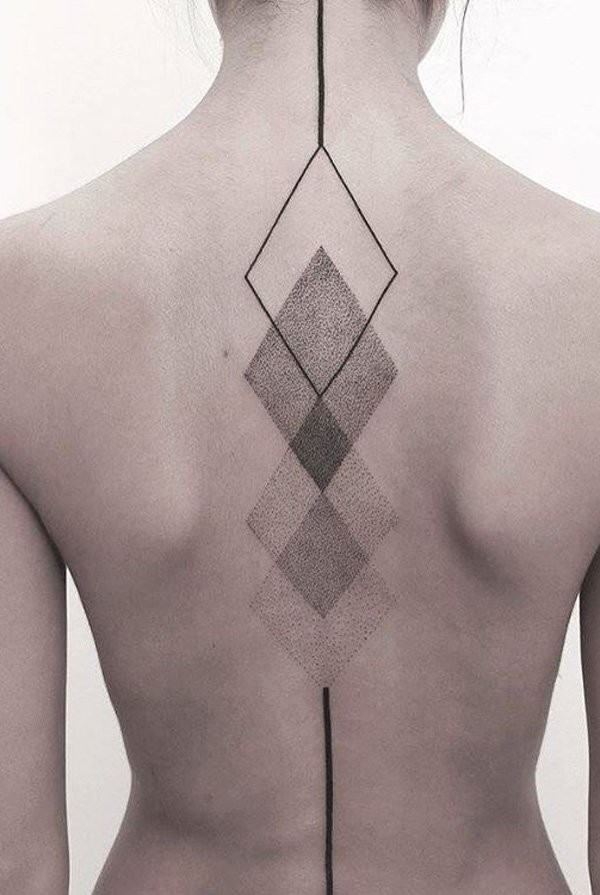 Gorgeous mystical designed black ink on back tattoo of geometrical figures