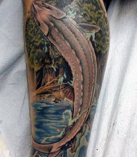 Gorgeous painted and detailed massive jumping fish tattoo on leg