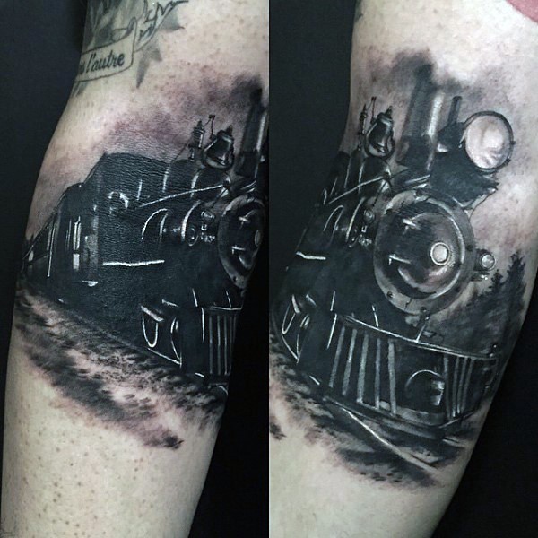 Gorgeous painted black and white train tattoo on leg