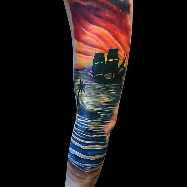 Gorgeous very beautiful colored sunset with ship and palm tree tattoo on sleeve