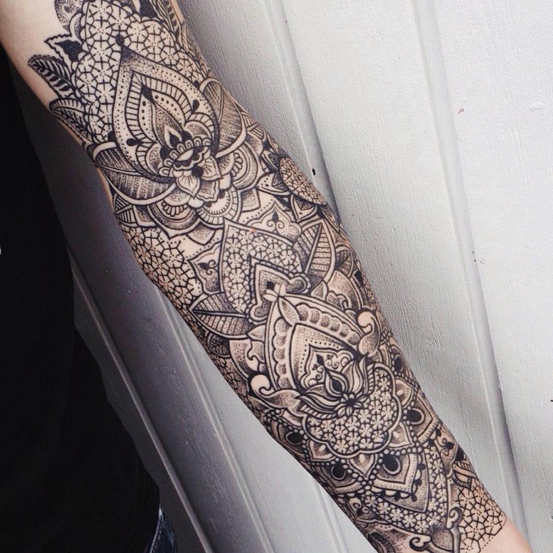 Gorgeous very detailed black and white forearm tattoo of Baroque style ornaments