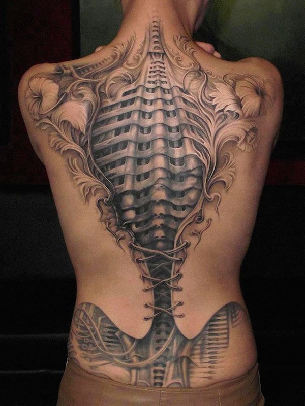 Gorgeous very detailed black and white human skeleton tattoo on hole back stylized with corset and flowers