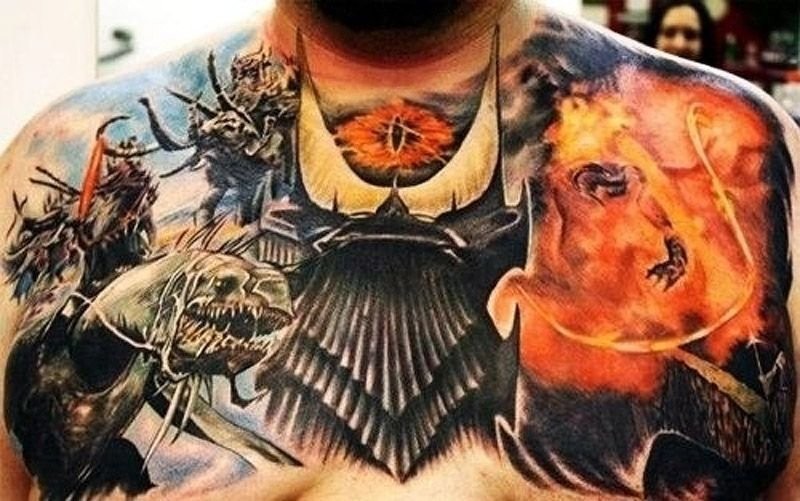 Gorgeous very detailed colorful Lord of the Rings themed tattoo on chest