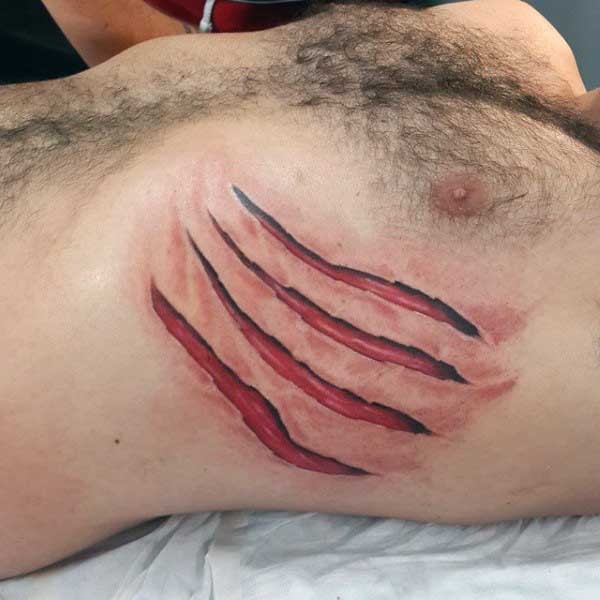 Gorgeous very realistic looking colored claw scar tattoo on chest