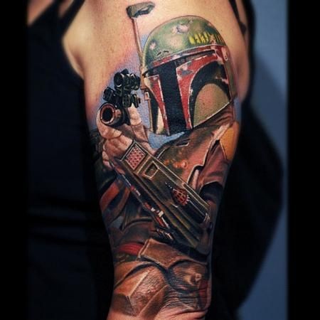 Gorgeous very realistic looking Star Wars themed on shoulder tattoo of Boba Fett portrait