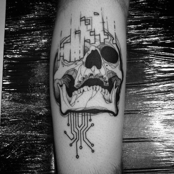 Graffiti style black ink leg tattoo of human skull with electronics