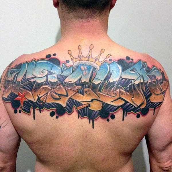 Graffiti style colored lettering tattoo on back with crown