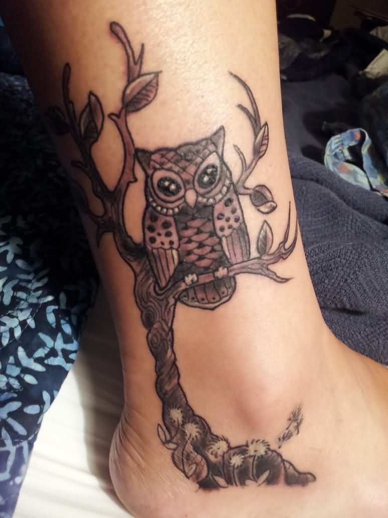 Gray cute owl on branch tattoo on ankle