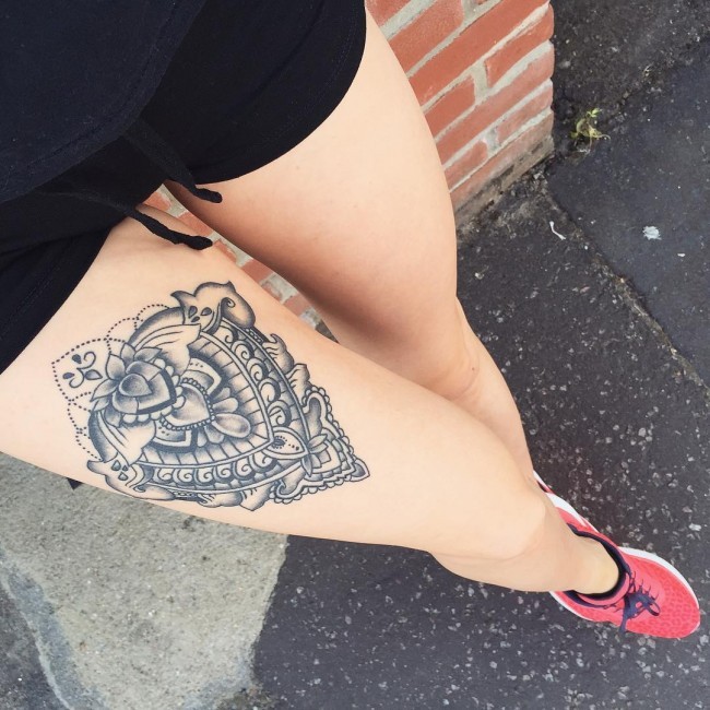 Gray washed black ink thigh tattoo of typical ornament
