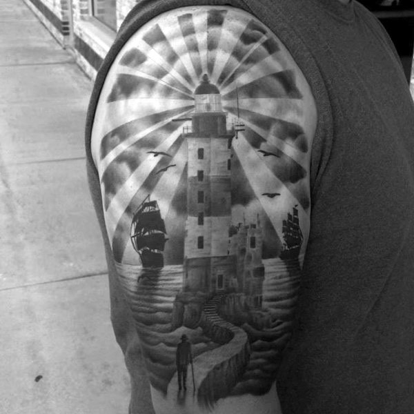 Gray washed detailed shoulder tattoo of large lighthouse with ships and person