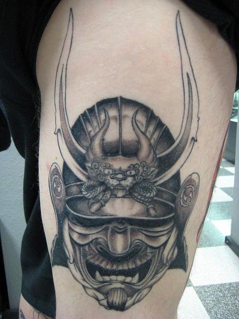 Gray washed style big detailed thigh tattoo of samurai warrior helmet